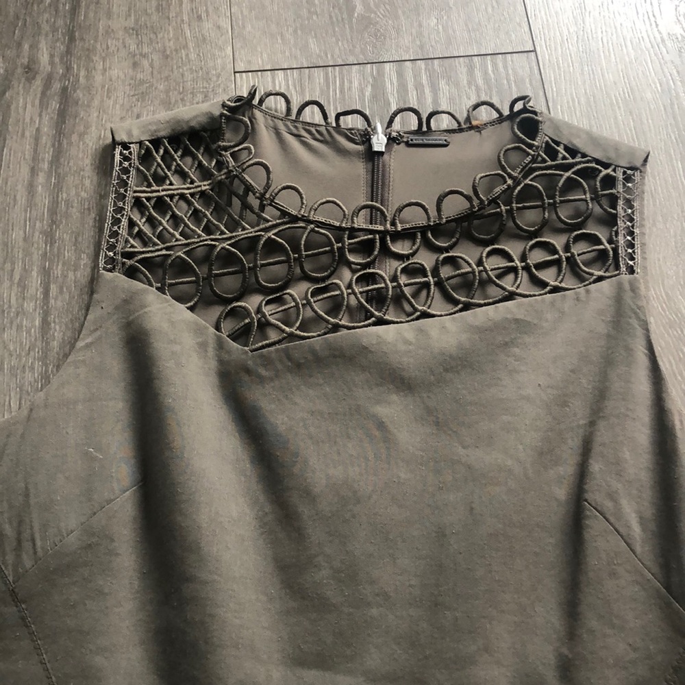 Fully lined fitted and flattering olive green dress with detailed neckline